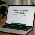 How to start your online business with Shopify a laptop on a desk showing the Shopify dashboard