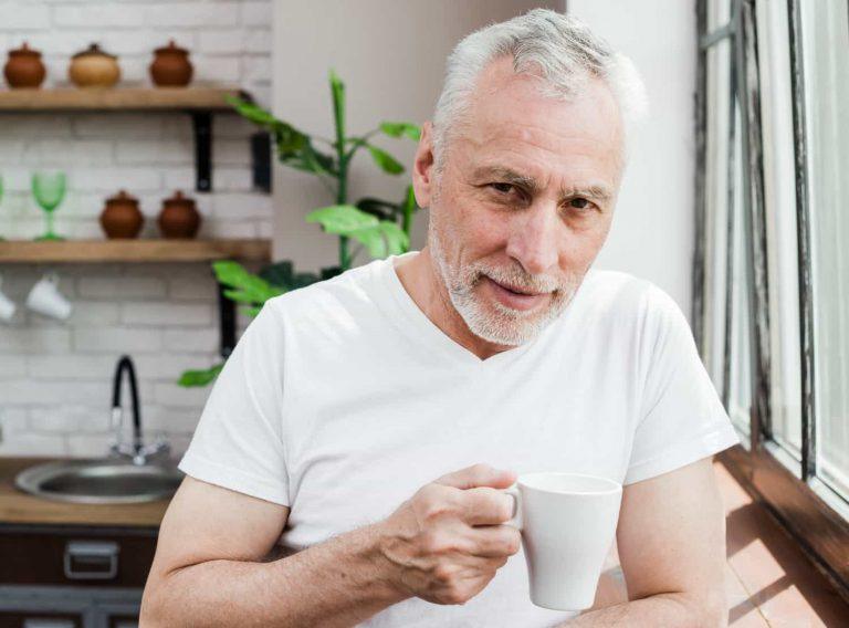 Man confidently smiling after using a supplement to support male sexual health